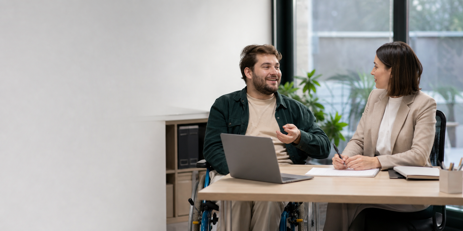 Adult NDIS participant who uses a wheelchair planning career goals with a career counsellor