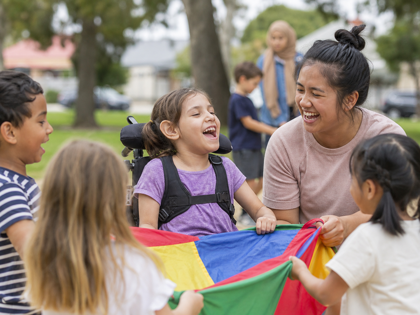 A child with disability playing outdoors with other children and a support worker